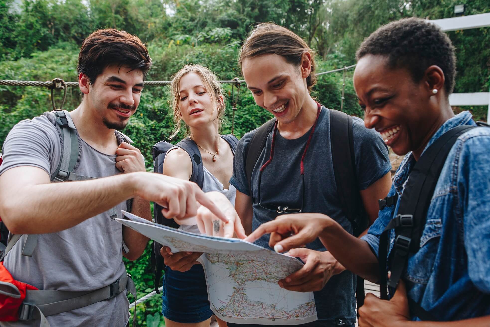 group-of-friends-looking-at-a-map-together-travel-P9J7MA8.jpg